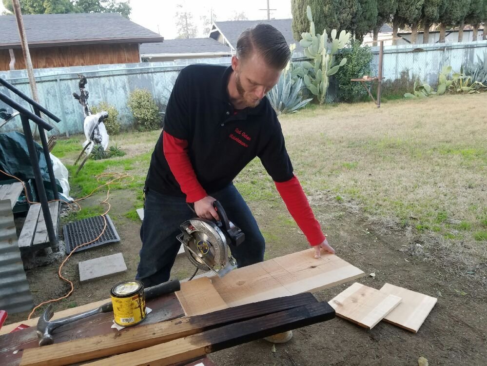 Red Gator Maintenance cutting lumber on a job